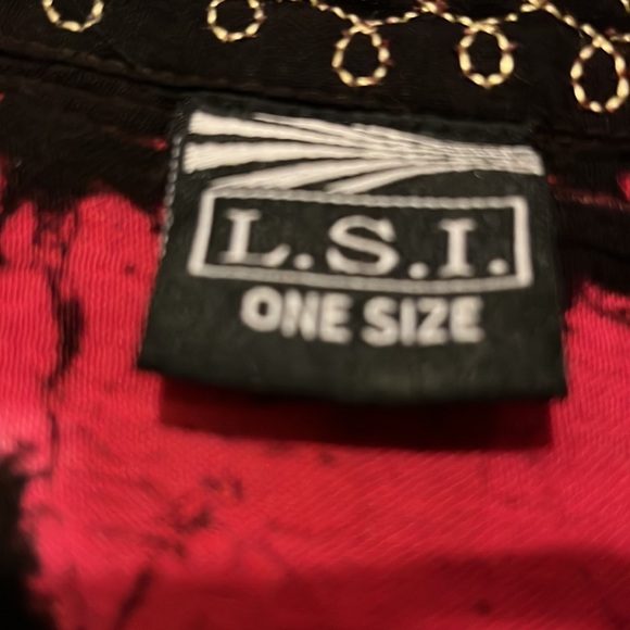 A black top with elephants, and then embroidery around the elephant and neckline - Picture 2 of 5